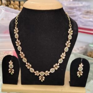 Long necklace with earring rings featuring green and white CZ stones, 22k gold plated, stylish design suitable for all occasions