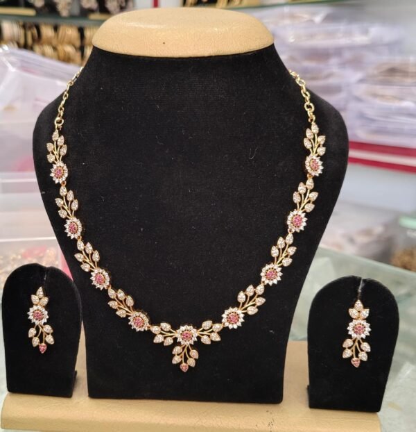 Long necklace with earring rings featuring red and white CZ stones, 22k gold plated, stylish design suitable for all occasions